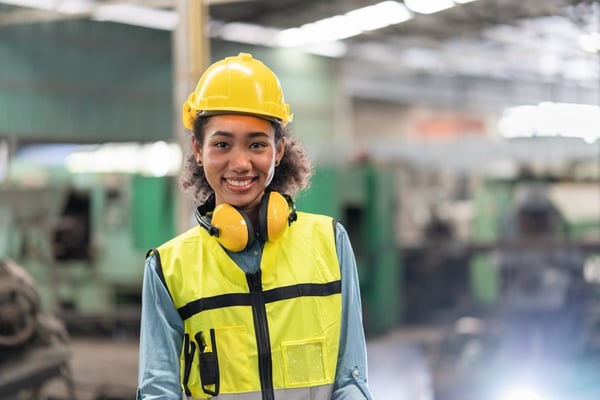 female machine tending operator