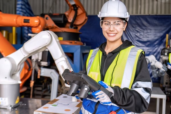 female machine tending operator