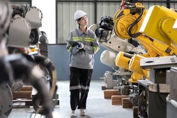 machinist walking through factory floor